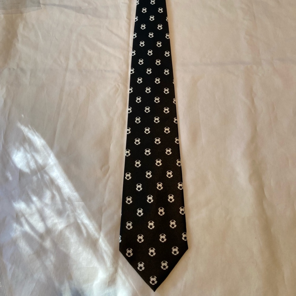 New without tags, black and white soccer tie